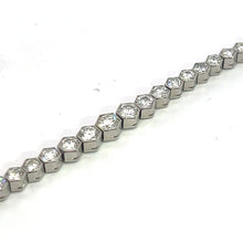 Load image into Gallery viewer, A close-up view of the Art Deco Platinum 4.90cttw Diamond Bezel Set 7.25inch Bracelet, featuring a series of hexagonal segments, each carefully bezel set with a small diamond. The bracelet is laid out in a straight line on a white background, showcasing its uniform and sparkly design reminiscent of classic Art Deco jewelry.