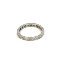 Load image into Gallery viewer, A vintage-inspired classic, the Art Deco Platinum .50cttw Antique Cut Diamond Eternity Band showcases a continuous row of small square-cut diamonds set in a prong setting, beautifully displayed against a plain white background.