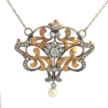 Load image into Gallery viewer, The Edwardian Platinum &amp; 18kt Yellow Gold 4.35cttw Old Mine, Rose Cut Diamond &amp; Pearl Necklace showcases intricate scrollwork and is embellished with numerous sparkling diamonds. At its center, a cluster of diamonds forms a floral pattern, exuding Edwardian elegance, and a single pearl dangles from the bottom. The pendant is attached to a delicate chain.