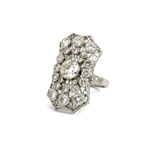 Load image into Gallery viewer, The Art Deco Platinum .93ct Old European Cut + 2.60cttw Ring showcases an intricate array of sparkling diamonds, with a striking large central diamond encircled by smaller diamonds in a beautifully ornate, elongated hexagonal setting. The band&#39;s simple and unadorned design exudes vintage luxury and timeless Art Deco elegance.