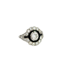 Load image into Gallery viewer, Presenting the Late Art Deco .90ct Round Brilliant Cut Diamond &amp; 1.96cttw Diamonds Black Enamel Ring, this exquisite piece showcases a central .90-carat round diamond, accentuated by striking black enamel and surrounded by a halo of smaller diamonds. The band also features delicate diamond embellishments, embodying an ornate and luxurious Late Art Deco aesthetic. Photographed against a plain white background for clarity.