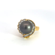 Load image into Gallery viewer, The Mid Century 14ktyg Black Pearl + 1.25ct diamond ring showcases a prominent black pearl at its center, surrounded by a pattern of small baguette diamonds and delicate round diamonds, all set in an elegant, scalloped design. This vintage jewelry piece is displayed against a plain white background.