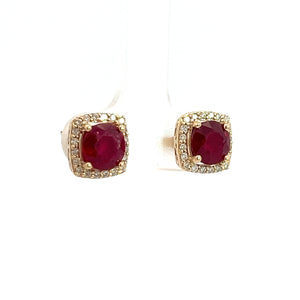 The Modern 14ktyg 2.43ct Vivid Red Rubies + .25cttw Diamond Stud Earrings each feature a square 14kt yellow gold setting adorned with small diamonds surrounding a large, round red ruby in the center, displayed on a simple white background. These pieces exemplify luxury jewelry at its finest.