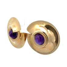 Load image into Gallery viewer, Introducing the Late Century Peter Wong 10ct Cabochon Amethyst Earrings: a stunning pair of gold-tone stud earrings featuring a unique swirl design, each adorned with a centered round cabochon amethyst gemstone. Demonstrating Peter Wong&#39;s artistic craftsmanship, these earrings boast a polished finish that enhances their elegant and sophisticated appeal.