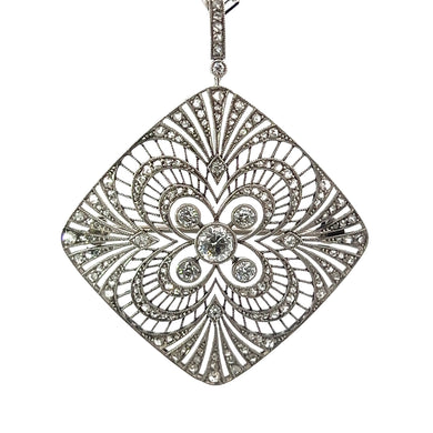 This exquisite Art Deco Platinum pendant showcases a .75-carat Old Mine Cut Diamond at its center, encircled by 2.85 carats of Old Mine and Rose Cut Diamonds arranged in a floral motif. The intricate filigree work, symmetrical patterns, and sparkling stones make this piece reminiscent of classically detailed Art Deco jewelry.