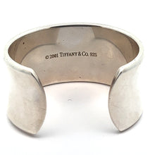 Load image into Gallery viewer, The Modern Tiffany Sterling Silver Cuff Bracelet c.2001 features a wide, polished surface for a contemporary look. Inside, it is engraved with &quot;© 2001 TIFFANY &amp; CO. 925,&quot; embodying its timeless elegance and the signature 1837 hallmark.