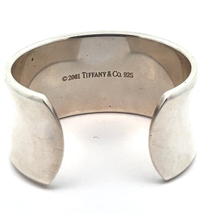 The Modern Tiffany Sterling Silver Cuff Bracelet c.2001 features a wide, polished surface for a contemporary look. Inside, it is engraved with "© 2001 TIFFANY & CO. 925," embodying its timeless elegance and the signature 1837 hallmark.