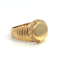 Load image into Gallery viewer, The Late Century 14ky Yellow Gold .24cttw Signet Ring, featuring a circular, textured top encircled by small, sparkling white stones, is showcased against a plain white background. The band exhibits a ridged design near the top that enhances its unique and intricate detailing, contributing to the ring&#39;s overall elegance from our fine jewelry collection.