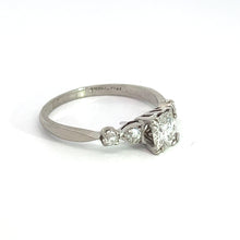 Load image into Gallery viewer, A vintage Art Deco piece, this ring features a central .50ct Old European cut diamond flanked by two smaller Old Mine cut diamonds totaling .28cttw, set in a minimalist band design. Crafted from polished platinum, the ring is showcased against a plain white background, accentuating its timeless elegance.