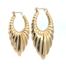 Load image into Gallery viewer, A pair of Late Century 14kt Yellow Gold Textured Drop Earrings featuring a ridged, scallop shell design hanging from clear earring hooks. These gold-toned earrings have a shiny, reflective surface and exude vintage charm, beautifully displayed against a plain white background.