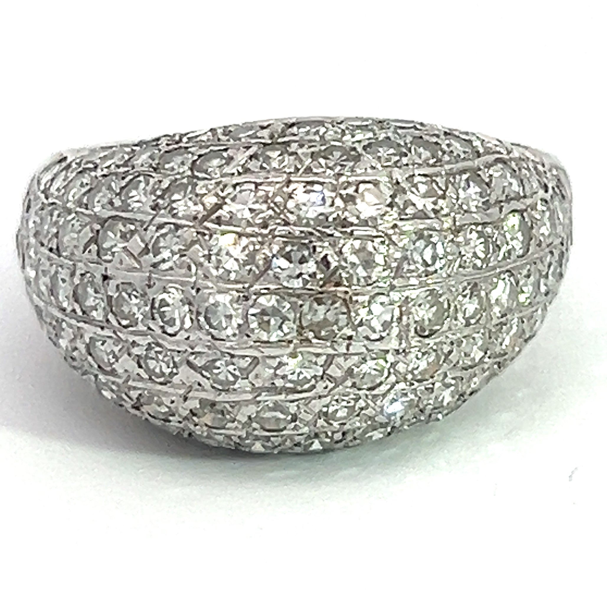 The Late Century 14kt White Gold 2.70cttw Round Brilliant Cut Pave Diamond Ring features a dome-shaped design encrusted with multiple rows of round brilliant cut diamonds, creating a textured and luxurious appearance. The ring is elegantly showcased against a plain white background, highlighting its intricate design and shimmering stones.
