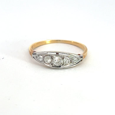 The Edwardian Platinum & 18kt Yellow Gold .50cttw Old Mine Cut Diamond Ring showcases a marquise-shaped setting adorned with four round old mine cut diamonds at its center. A thin band of polished platinum and 18kt yellow gold enhances the ring's sleek, elegant design, perfectly highlighting the brilliance of the diamonds against a plain white background.