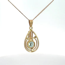 Load image into Gallery viewer, The Art Nouveau 14kt Yellow Gold 2ct Blue Zircon Necklace features a gold teardrop-shaped pendant with an intricate openwork design, showcasing a central round blue zircon gemstone, elegantly hanging from a delicate 14kt yellow gold chain against a white background.