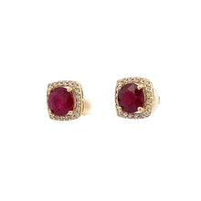 Load image into Gallery viewer, The Modern 14ktyg 2.43ct Vivid Red Rubies + .25cttw Diamond Stud Earrings feature stunning oval-shaped red gemstones, each encircled by a halo of small clear diamonds. The luxury jewelry is elegantly displayed against a plain white background.