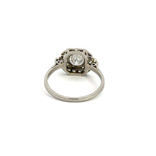 Load image into Gallery viewer, The Art Deco Platinum .80ct Round Brilliant Cut + 1.08cttw Diamond Ring features a round brilliant cut diamond set in a geometric bezel setting. The ring&#39;s band is simple and unadorned, directing attention to the central diamond. The overall design exudes a vintage Art Deco aesthetic, beautifully showcased against a plain white background.