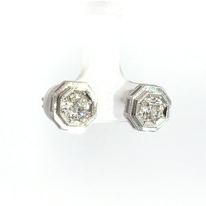 The Art Deco Platinum Topped & 14kt White Gold 1.09ct Old European Cut Diamond Hexagon Frame Studs feature a pair of round, Old European Cut diamonds set in hexagonal platinum-topped 14kt white gold frames. These vintage-style Art Deco earrings are displayed against a plain white background.