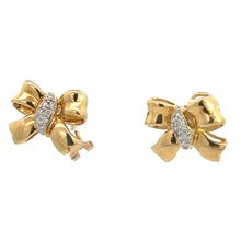 Load image into Gallery viewer, A pair of Mid Century 18kt Yellow Gold Bow Earrings, featuring small, dazzling .50cttw diamonds in the center. The bows have a polished finish, and the diamonds add a touch of sparkle. One earring has a small key charm hanging from the bow, adding vintage charm against a plain white background.