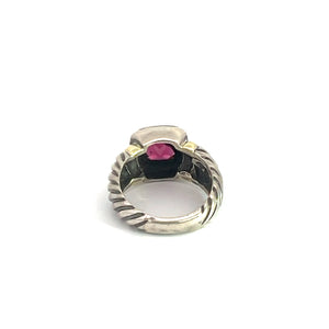 A detailed view of the Late Century 14ktyg/silver David Yermen Ring, showcasing a twisted rope design in sterling silver and a striking rectangular 2.50ct garnet gemstone. The ring features an elevated setting that elegantly positions the gemstone above the band, all set against a plain white background.