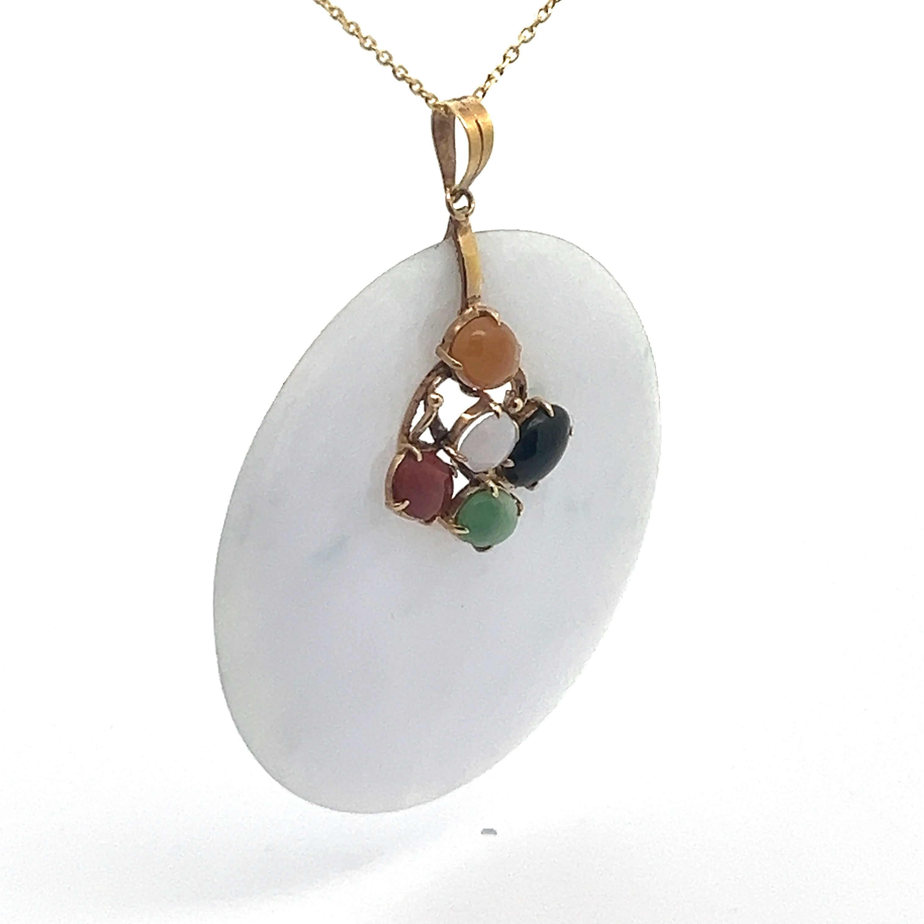 A Late Century 14ktyg necklace showcases a large, round lavender jade pendant adorned with a delicate arrangement of five small, multi-colored jade beads—featuring hues such as red, white, green, orange, and black—set in 14kt yellow gold.