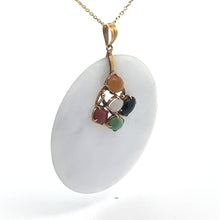 Load image into Gallery viewer, The Late Century 14kt yellow gold pendant features a circular white charm adorned with a 14kt yellow gold attachment on a thin gold chain. The attachment is decorated with five small gemstones of varying colors: orange, white, black, red, and green. The background is plain white.