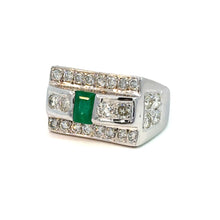 Load image into Gallery viewer, Behold the Late Century 14kt White Gold Ring, featuring a breathtaking 1ct emerald-cut emerald at its center. This mesmerizing green gem is accentuated by a total of 5.70 carats of round brilliant cut diamonds arranged in three vertical rows, with two rows on one side and one row on the other side. The ring boasts a broad, rectangular band crafted from luxurious 14kt white gold.