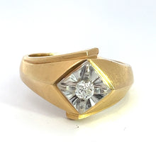 Load image into Gallery viewer, The &quot;Late Century 14kt Two Tone Gold .25ct Old Mine Cut Diamond Ring&quot; showcases a distinctive asymmetrical design. Its centerpiece, a small round old mine cut diamond, is set in a recessed geometric pattern adorned with silver-toned accents. The broad, smooth band features gentle curves that enhance its vintage appeal.