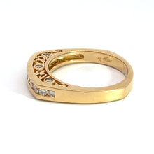 Load image into Gallery viewer, The Late Century 14kt yellow gold .78cttw Round Brilliant Cut Diamond Band features a rectangular shape adorned with multiple round brilliant cut diamonds set along its upper side. The sides of the ring showcase intricate, openwork detailing that exudes timeless elegance. A hallmark is stamped on the inner band.