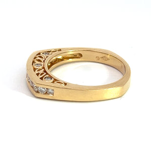 The Late Century 14kt yellow gold .78cttw Round Brilliant Cut Diamond Band features a rectangular shape adorned with multiple round brilliant cut diamonds set along its upper side. The sides of the ring showcase intricate, openwork detailing that exudes timeless elegance. A hallmark is stamped on the inner band.