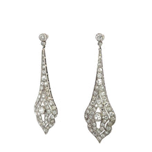 Load image into Gallery viewer, The Art Deco Platinum 8cttw Old Mine Cut &amp; Antique Cut Diamond Drop Earrings feature an elegant, vintage style with intricate teardrop designs adorned with numerous small, sparkling diamonds. Their delicate, lacy appearance is completed with a round stone at the top connecting to the teardrop shapes below.