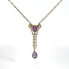 Load image into Gallery viewer, This Victorian 14kt Yellow Gold 3.50cttw Amethyst Pearl Lavalier Necklace features an ornate pendant adorned with an oval-shaped amethyst at the center and a teardrop-shaped purple gemstone elegantly dangling below. The chain is composed of small interlocking links.