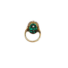 Load image into Gallery viewer, An Art Deco platinum and 18kt yellow gold ring with a .75ct old mine cut diamond and 1.90cttw diamonds exudes timeless charm. The vivid green enamel detailing, adorned with intricate embellishments, enhances the elegance of the oval stone. A simple yet sophisticated band completes this exquisite piece.