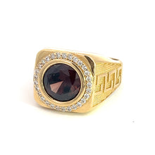 Load image into Gallery viewer, The Late Century 14ktyg ring boasts a striking 4.5-carat dark garnet at its center, surrounded by a shimmering halo of diamonds totaling 0.75 carats. The shank is intricately engraved with a Greek key pattern, creating a design that is both bold and luxurious, reminiscent of late-century elegance.