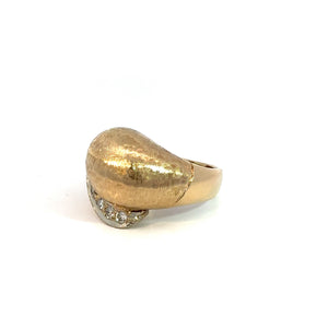 The Late Century 14kt Yellow Gold .50cttw Diamond Ring with Satin Finish boasts a smooth, polished dome design paired with a subtle brushed texture. Featuring several small, sparkling diamonds arranged in a row near the base of the dome, this ring has a shiny band that exudes vintage charm and simple elegance.