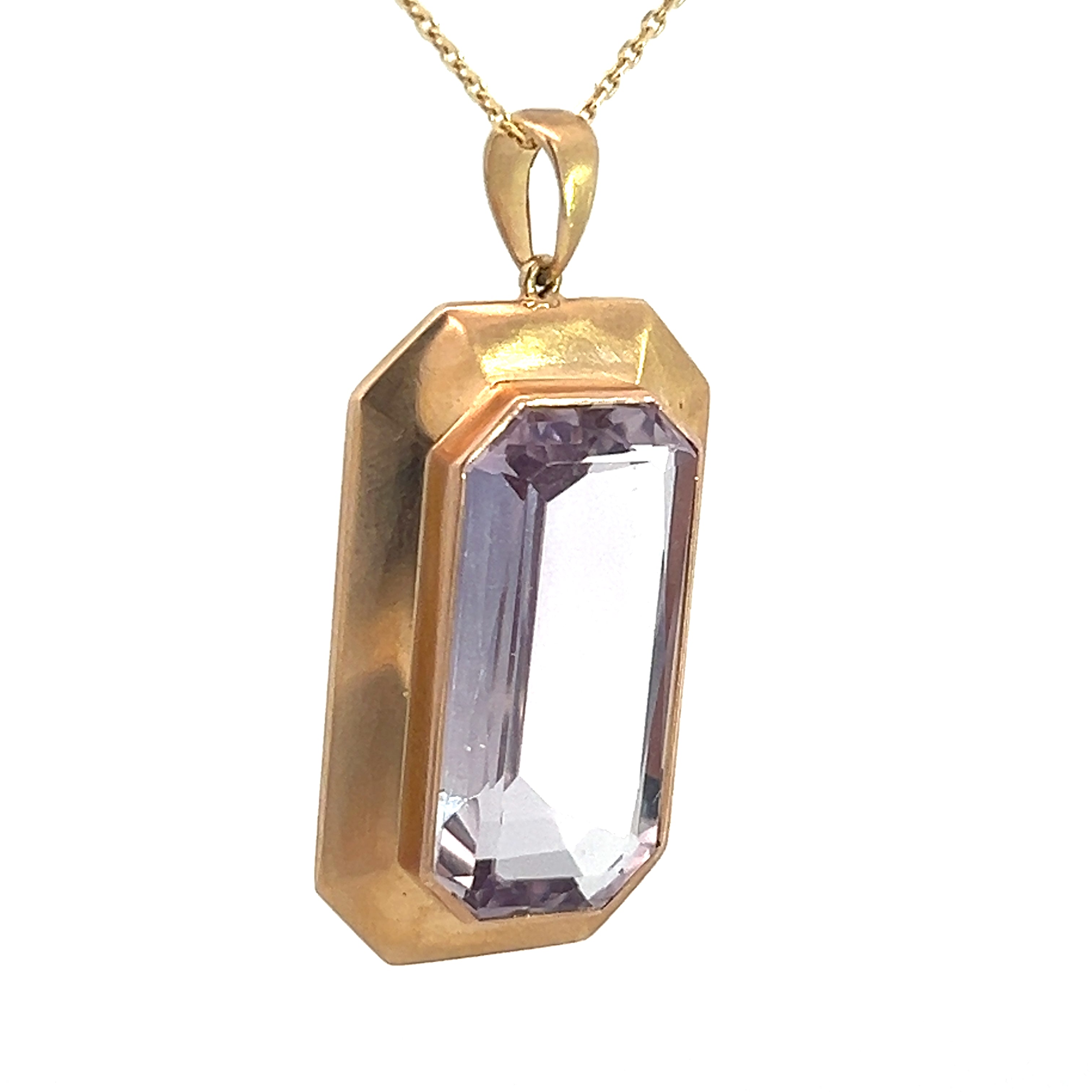 The Art & Crafts 14ktyg 8ct Kunzite pendant "HA to EC Sept 15, 1908" features a large rectangular-cut, light purple kunzite gemstone set in a gold setting. The pendant has a geometric, beveled frame and hangs from a delicate gold chain.