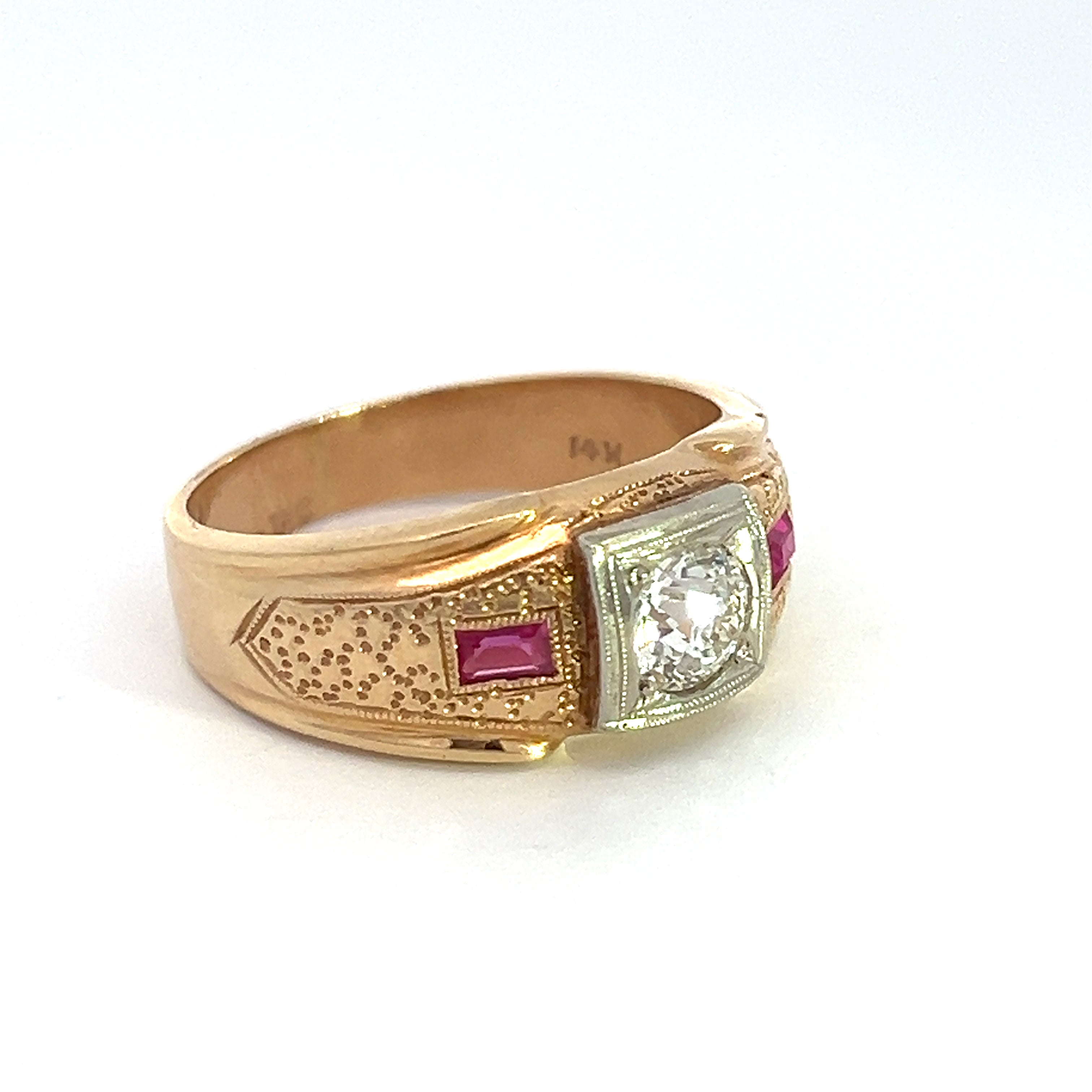 Introducing an exquisite Art Deco 14k yellow gold ring, featuring a .60-carat Old European Cut diamond at its center, flanked by two rectangular synthetic rubies. The ring's polished finish and intricate detailing exemplify a perfect blend of elegance and craftsmanship.