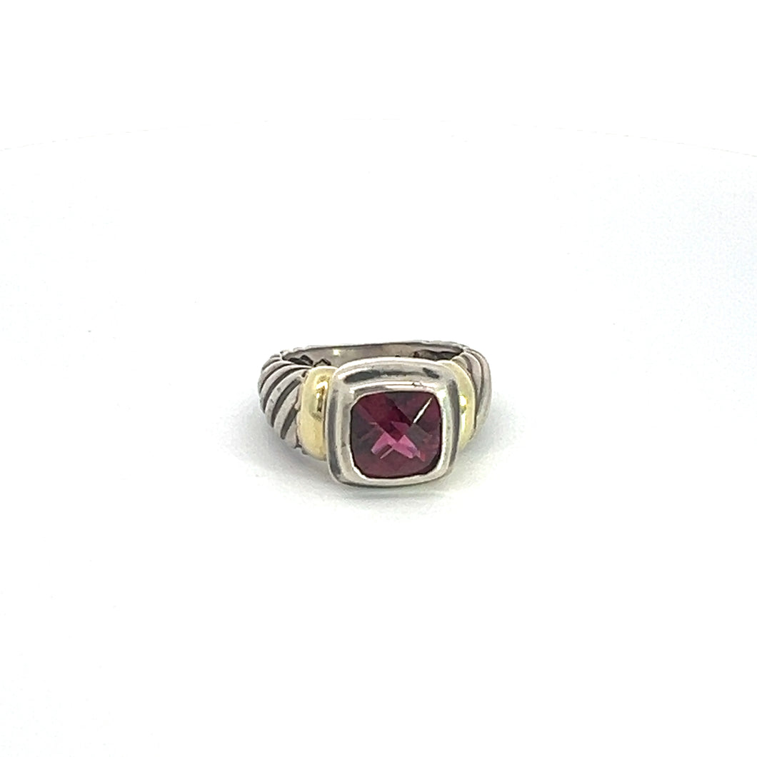 The Late Century 14ktyg/silver David Yermen 2.50ct Garnet Ring features a wide band with a grooved design made of sterling silver. At its center, it showcases a square, deep pink garnet gemstone, beautifully framed by a smooth, 14kt yellow gold bezel setting that offers a striking contrast against the silver band.