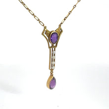 Load image into Gallery viewer, This 14kt yellow gold necklace is a Victorian jewelry masterpiece, showcasing an ornate pendant adorned with a striking purple oval gemstone. Dangling below are three delicate pearls that lead to a teardrop-shaped amethyst at the bottom. The entire piece is suspended from a gold chain with elegant rectangular links, making it an exquisite Amethyst and Pearl Lavalier Necklace.