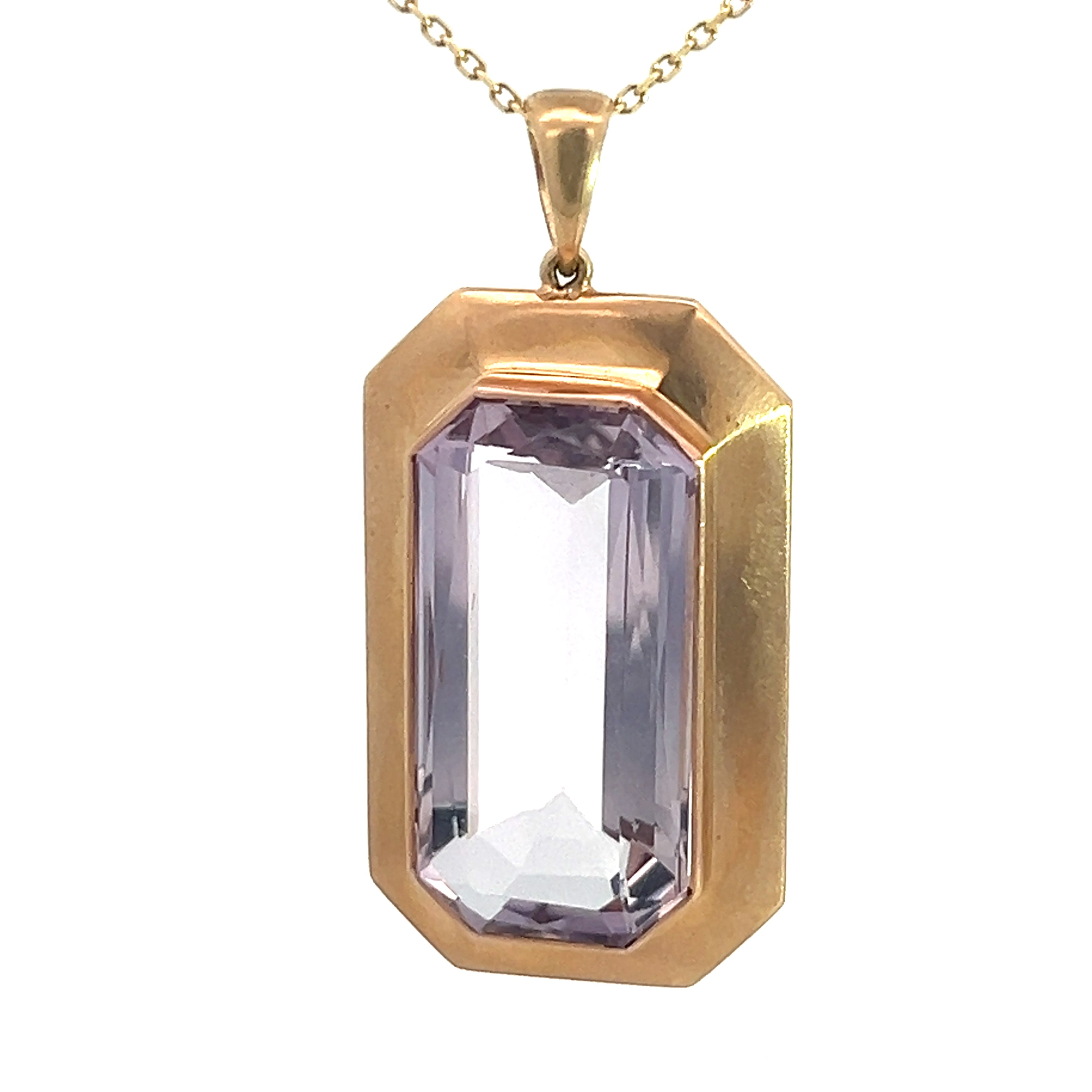 The Art & Crafts 14ktyg 8ct Kunzite pendant "HA to EC Sept 15, 1908" features a large rectangular-cut, light purple kunzite gemstone set in a gold setting. The pendant has a geometric, beveled frame and hangs from a delicate gold chain.
