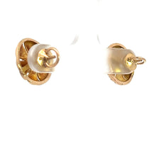 Load image into Gallery viewer, Close-up image of a pair of Art Deco 14kt yellow gold .50cttw Old European Cut diamond stud earrings with butterfly backs. The earrings are attached to a transparent display holder, with their front sides facing towards the background and the backs clearly visible. The background is plain white.