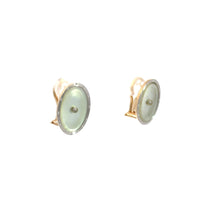 Load image into Gallery viewer, A pair of Art Deco 14kt yellow and white gold Mother of Pearl Omega back earrings, designed with round, green-toned gemstones and gold trim. These vintage-inspired earrings are displayed on a plain white background.