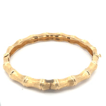 Load image into Gallery viewer, The Late Century 14ktyg Bamboo Style Bangle Bracelet boasts a bamboo-like textured design with subtle ridges and nodes that mimic the appearance of bamboo stalks, giving it a natural and elegant look. This stunning piece of luxury jewelry is showcased against a solid white background.