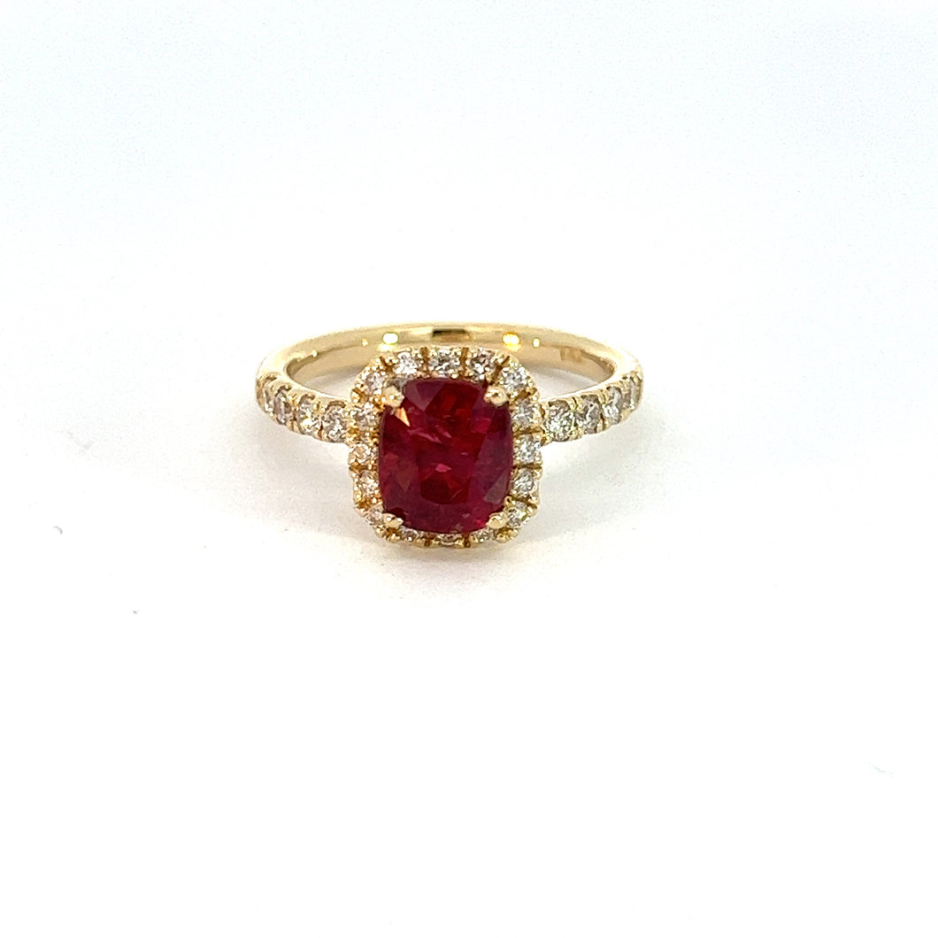 Introducing our Modern 14kt Yellow Gold 2.02 No Heat Mozambique Ruby + .50cttw Diamond Ring, which showcases a rectangular no-heat Mozambique ruby at its center, encircled by a dazzling diamond halo. The band is adorned with small white diamonds that enhance its sparkling and elegant appearance against a plain white background.