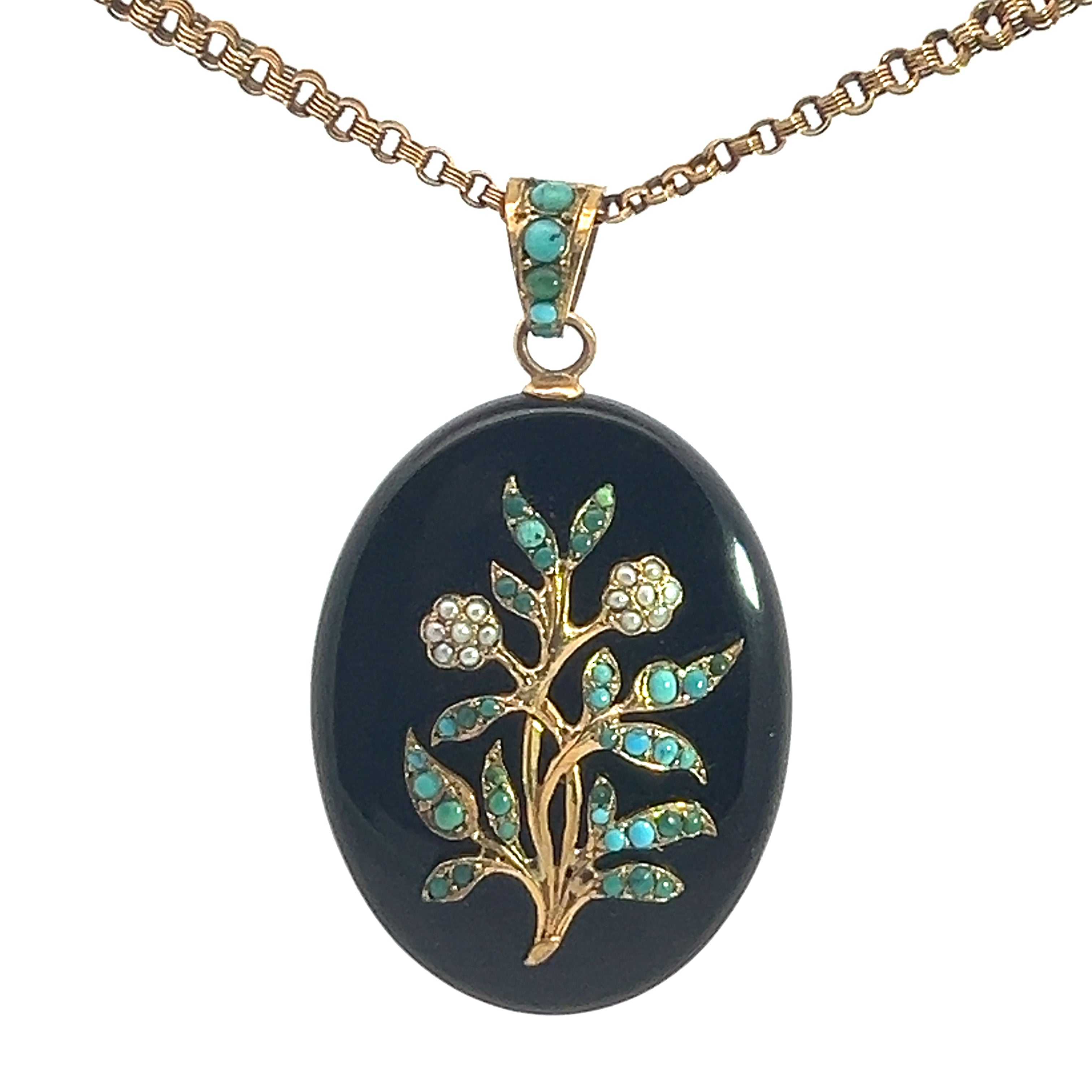 The Victorian 14ktyg Turquoise + Pearl locket on a Victorian chain is an elegant oval-shaped black locket adorned with a gold floral design. It features delicate turquoise stones in the leaves and pearl-like stones in the flowers, all hanging from a 14kt yellow gold chain.