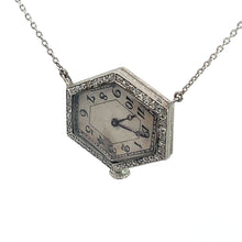 Load image into Gallery viewer, Introducing the Art Deco Platinum Pentagon Shape Watch, featuring an 18kt white gold 20-inch chain. The watch face, adorned with black Arabic numerals and crowned at the bottom edge, is reminiscent of the classic Art Deco era. Surrounded by a decorative border set with a total of .88 carats of clear diamonds, this piece exudes timeless elegance and luxury.