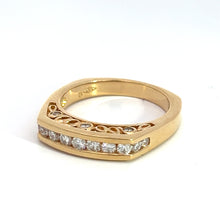 Load image into Gallery viewer, The Late Century 14kt Yellow Gold Diamond Band showcases .78 carats of round brilliant cut diamonds set in a unique geometric design across the top. This band epitomizes timeless elegance with its intricate cut-out detailing along the inner side, and stands out prominently against a white background.