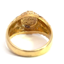 Load image into Gallery viewer, A close-up view of the Late Century 14ky Yellow Gold .24cttw Signet Ring, showcasing its inner band adorned with intricate details and markings. The design is elaborate, with the inner surface of the band reflecting light to exhibit a polished finish. This exquisite piece from our fine jewelry collection is positioned upright, revealing its inner side to the camera.