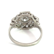 Load image into Gallery viewer, Introducing the Art Deco Platinum .91ct Old European Cut Diamond + 1.60cttw Diamond Ring, featuring an intricate geometric design with numerous small white gemstones. At its center lies a larger old European cut diamond, surrounded by an openwork pattern that enhances its detailed and elegant Art Deco aesthetic.