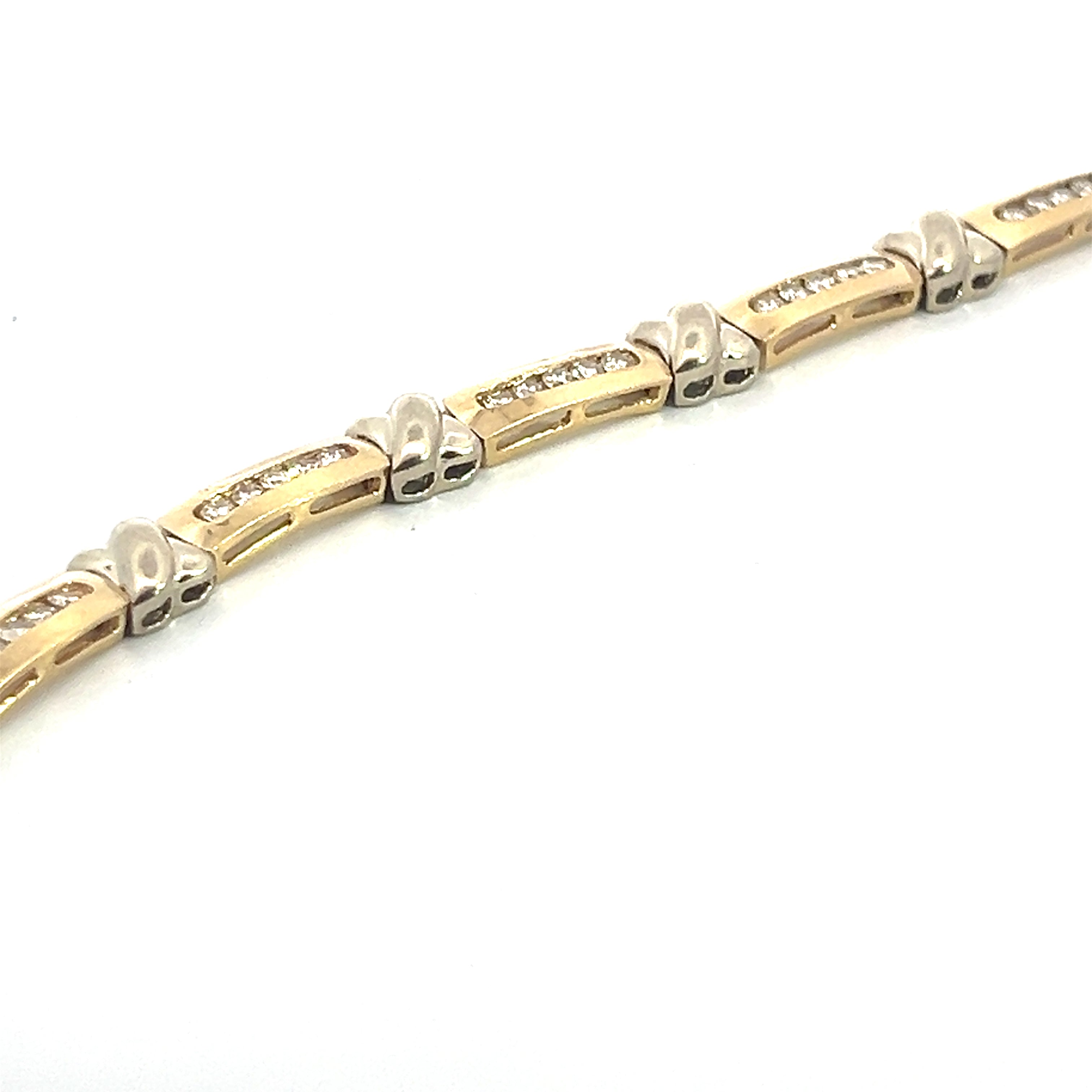 A close-up image of the "Late Century 14ktyg 3.08ct Round Brilliant Cut Diamond X Tennis Bracelet" reveals its intricate design, featuring rectangular gold links each adorned with a row of round brilliant cut diamonds. The silver connectors between the links boast a smooth, polished finish. The 7.5-inch bracelet is set against a white background.