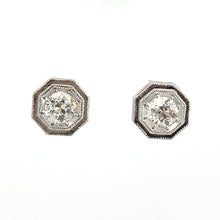 Load image into Gallery viewer, A pair of Art Deco Platinum Topped &amp; 14kt White Gold 1.09ct Old European Cut Diamond Hexagon Frame Studs. Each earring features an old European cut diamond at the center, surrounded by intricate detailing on a plain white background.