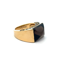 Load image into Gallery viewer, The &quot;Late Century 18kt Yellow Gold Smokey Topaz + 2cttw Yellow Sapphires Designed By Agori&quot; is a gold ring boasting a large, rectangular smokey topaz gemstone set diagonally. The inner band of the 18kt yellow gold ring is engraved with the word &quot;AGORI.&quot; Featuring a modern, angular design, this elegant piece rests on a white surface.